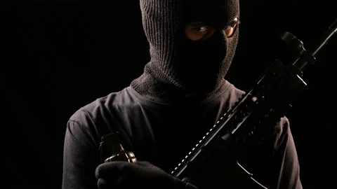 Terrorist with automatic rifle and hand grenade Stock Footage 142271576
