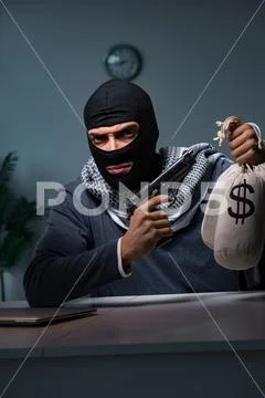 Terrorist burglar with gun asking for money ransom Stock Photos