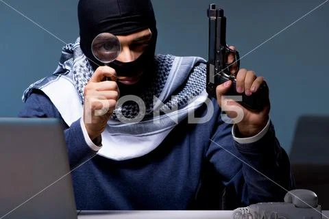 Terrorist burglar with gun asking for money ransom Stock Photos