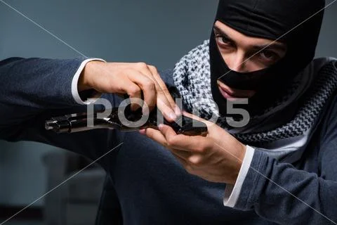 Terrorist burglar with gun asking for money ransom Stock Photos