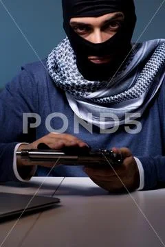 Terrorist burglar with gun asking for money ransom Stock Photos