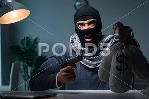 Terrorist burglar with gun asking for money ransom Stock Photos