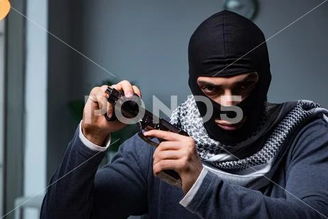 Terrorist burglar with gun asking for money ransom Stock Photos