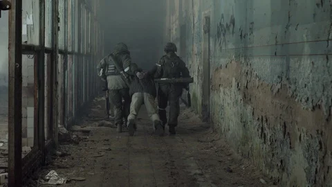 Terrorist is catching a soldier as a hostage. Stock Footage 129750071