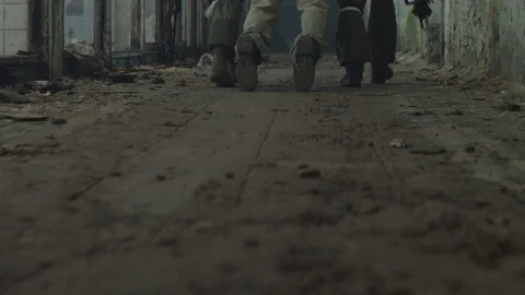 Terrorist is catching a soldier as a hostage. Stock Footage 129751015