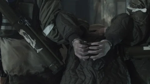 Terrorist is catching a soldier as a hostage. Stock Footage 129752676