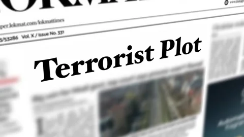 Terrorist Plot headline written on economy and business newspapers concept. 4K Stock Footage 245339965