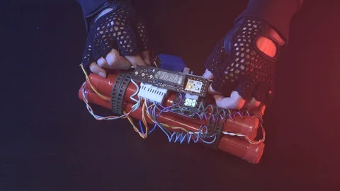 Terrorist Preparing a Dynamite Time Bomb Stock Footage 90713930