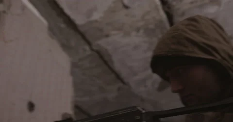 The terrorist shoots from the AK-47 automatic machine. Concept: terrorist attack Stock Footage 153626091