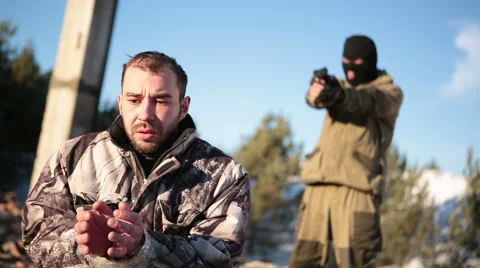 Terrorist shoots the hostage Stock Footage 45320016