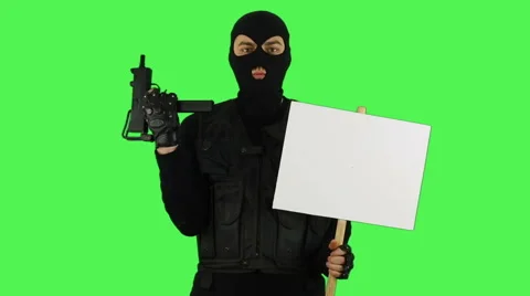 Terrorist with sign on green screen Stock Footage 61261249