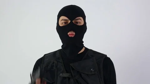 Terrorist with submachine gun and sign on white background Stock Footage 73474136