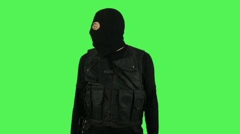 Terrorist with submachine gun on green screen Stock Footage 61260412