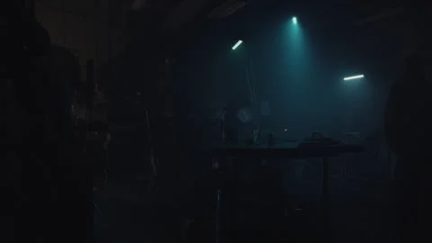 A terrorist in the Warehouse making a bomb Stock Footage 256034599