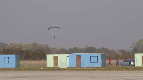 Terrorists try to escape when anti terrorism paratroops land on the battlefield Video stock 82687464