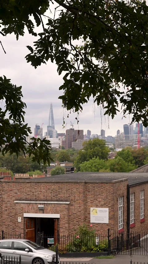 Tesco Delivery Van Passing London Brick School with Shard Skyline Background 動画素材 346889820