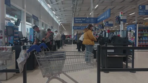Tesco Extra Checkout Area with Customers Purchasing Groceries Stock-Footage 339302176