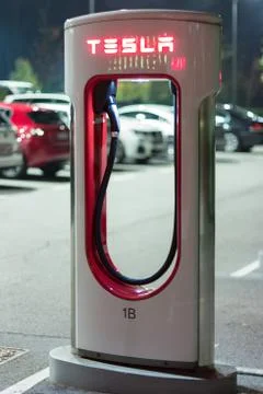 Tesla car charger at night Stock Photos