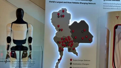 Tesla EV Charger and Humanoid Robot Showroom Exhibit in Bangkok Stock Footage 345513360
