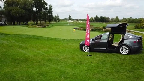 A tesla on golf field Stock Footage 115992567
