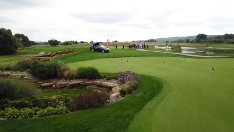 A tesla on a golf field Stock Footage 115992610