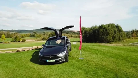 A tesla on a golf field Stock Footage 115993320