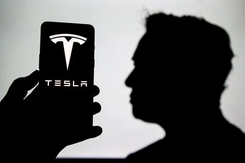 Tesla logo on screen Stock Photos