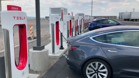 Tesla Model 3 charging at a 250 kW Tesla Supercharger, Beaver, Utah. Stock Footage 172362286