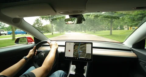Tesla Model 3 Driving along Minnehaha Falls Stock Footage 91354549