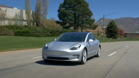 Tesla Model 3 - Driving - Front 3-quarter angle Stock-Footage 93418595