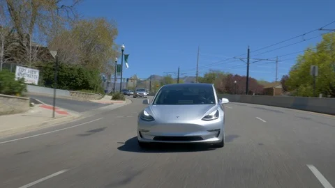 Tesla Model 3 - Driving through corners - Front view Stock-Footage 93419534