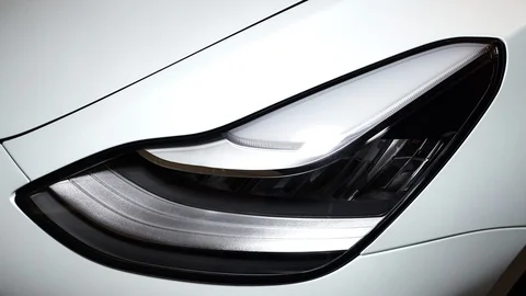 Tesla Model 3 Headlight with sweeping illumination Stock Footage