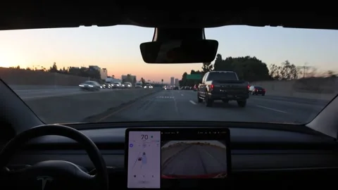 Tesla Model 3 Performs Automatic Lane Changes Stock Footage 142279394