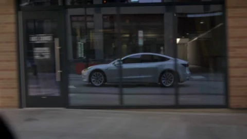 Tesla Model 3 Reflected in building Stock-Footage 93414250