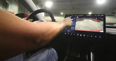 tesla model 3 self parking garage