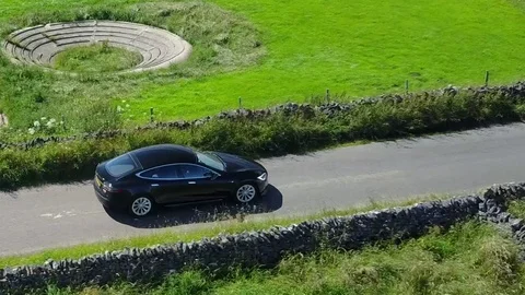 Tesla model S aerial shot Stock Footage