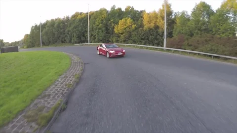 Tesla Model S driving around a round about Video stock 80650874