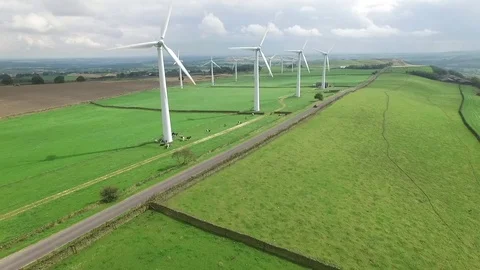 Tesla Model S in front of wind turbine Video stock 80650833