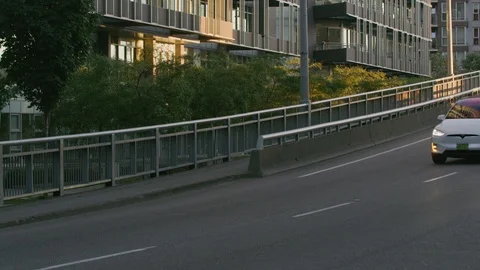 Tesla Model X driving off ramp in urban city at dusk Stock-Footage 103391963