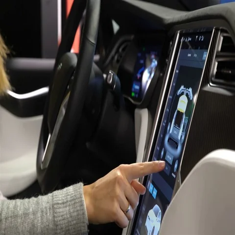 Tesla Model X electric car. Woman tasting a new vehicle functions. Video stock 69502550