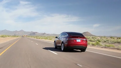 Tesla Model X - Rolling Rear Shot with Pull-away Stock-Footage 71011482