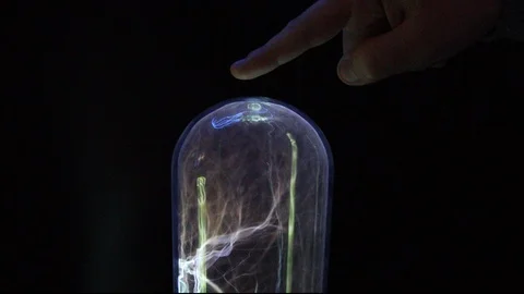 Tesla plasma lamp with black background - one hand touches the lamp 스톡 동영상 124506803