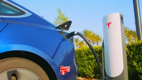 Tesla Plugged in Medium Shot Stock Footage 130295759