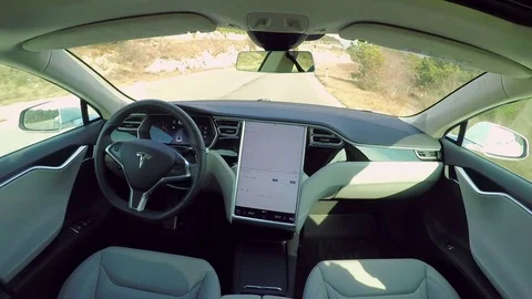 Tesla self-driving absolutely autonomous car driving without human intervention Stock Footage 73123119