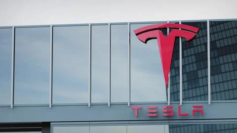 Tesla Stock data presented on the logo of the office facade editorial Stock Photos