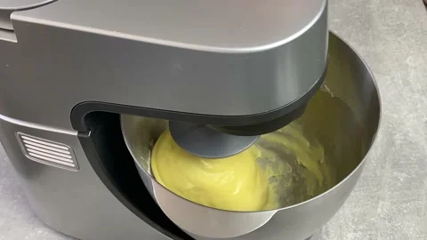 Test batch. Cooking dough on a combine. The kitchen machine stirs the dough for Stock Footage 237190849