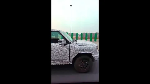 Test car wrapped with a weird pattern to disguise it on the road. Vertical. Stock Footage 307597546