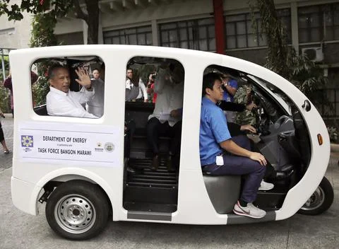Test drive of energy efficient electric tricycles in Taguig city, Philippines -  Stock Photos