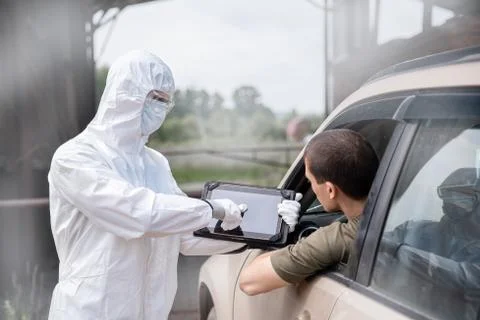 Test driver check for coronavirus, bubonic plague at border of cities and Stock Photos