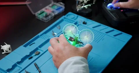 Test flight of the FPV drone after repair A close-up of the hands of an engineer Stock Footage 262769276